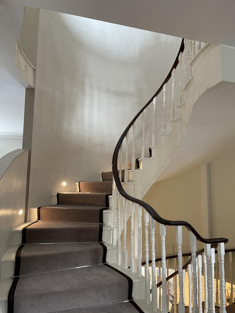 Curved carpeted staircase